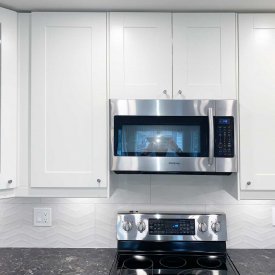 White Kitchen Cabinet with Dark Countertop