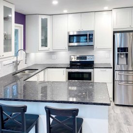 Full Kitchen Renovation with Dark Countertop and White Cabinet